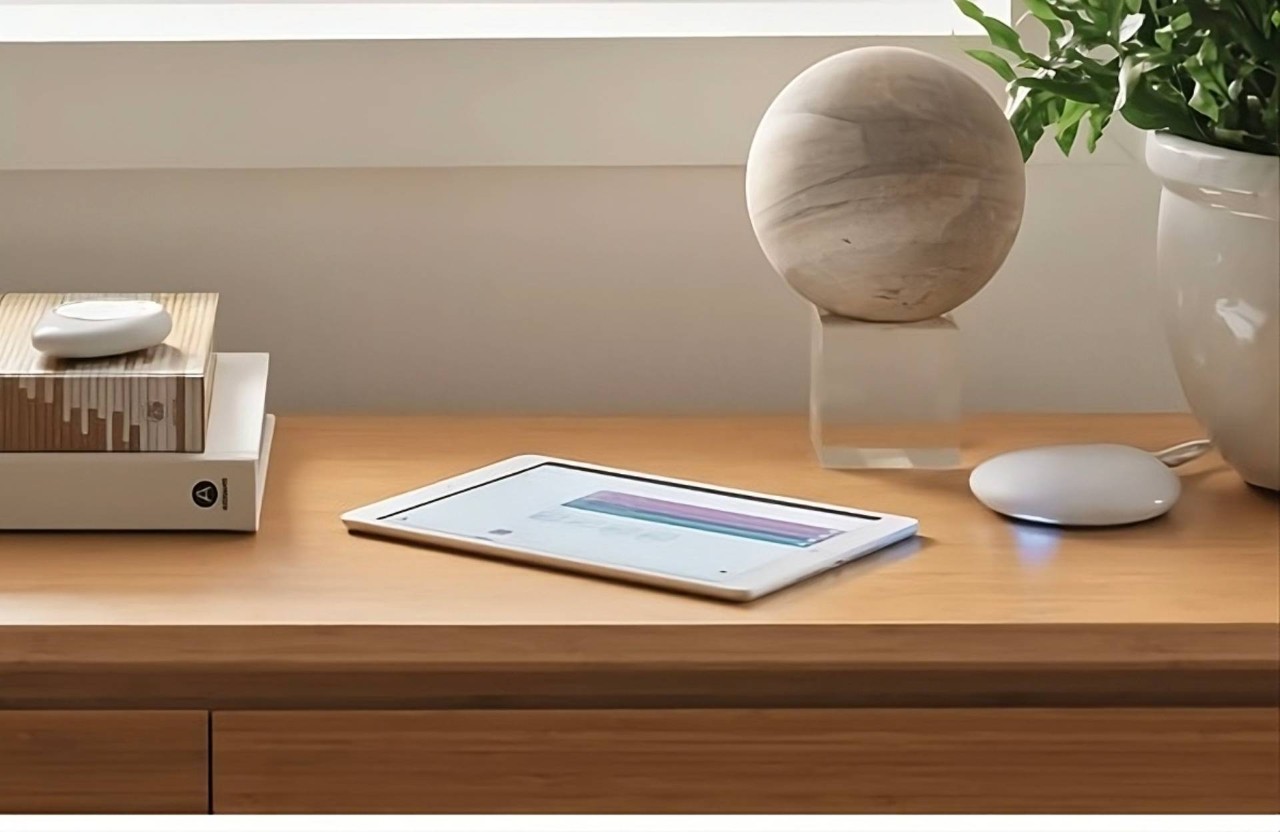 A tablet next to the PowerView® Gateway from Hunter Douglas at Unusual Designs Inc. near Newport News, VA