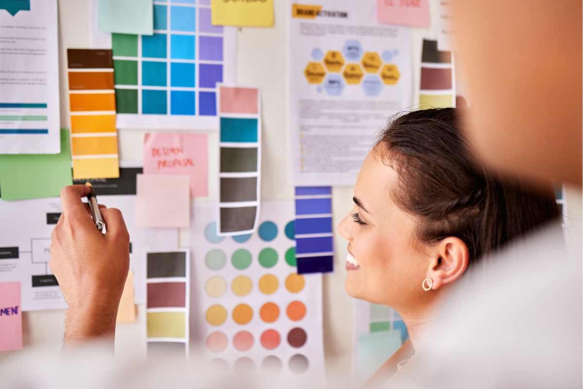 Two people looking at color swatches and comparing different colors during an interior consultation